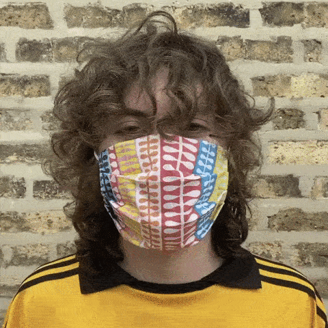 An animated GIF of Sammy Tweedy wearing the Curtains Mask.